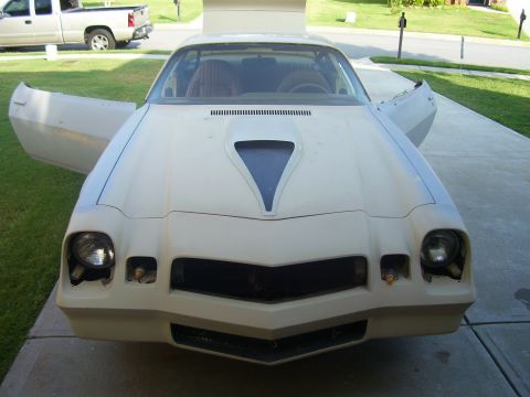 1979 Chevrolet Camaro - This 1979 Chevrolet Camaro is shown from the front with its doors open and in a primer finish.