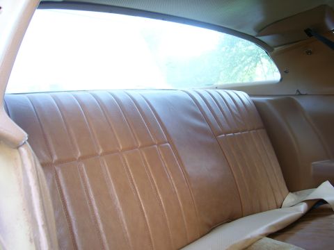 1979 Chevrolet Camaro - Interior view of the rear seat and side paneling in a 1979 Chevrolet Camaro.