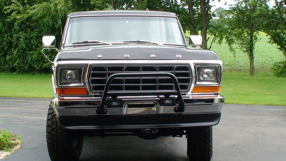 Front view of a black 1979 Ford Bronco with a bull bar