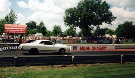 1972 Ford Ranchero - A white 1972 Ford Ranchero with a red stripe races down the Milan Dragway.