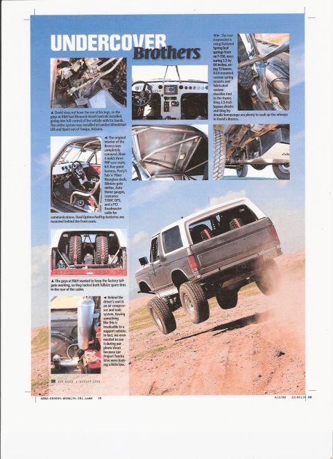 2008 Ford Bronco - This modified Ford Bronco is shown off-roading on a sandy incline, demonstrating its suspension and off-road capabilities.