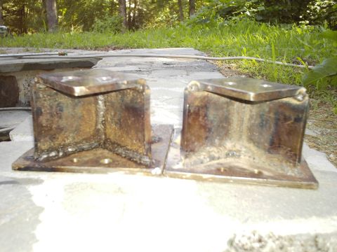 1994 Ford F-150 - Two custom shackle flip brackets are shown, likely for a truck suspension modification.