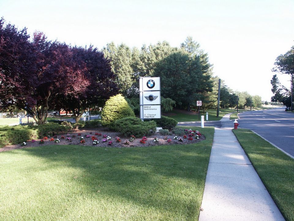 BMW of North America sign with landscaping and a sidewalk