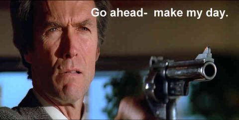 1991 Ford Crown Victoria - A man holds a revolver and speaks to the camera.