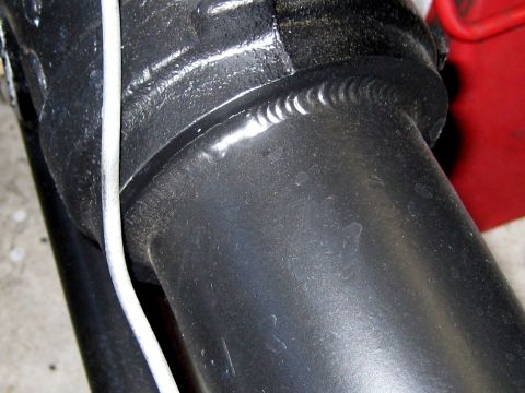 1996 Ford Bronco - This image shows a close-up view of a welded metal component, likely from a vehicle's undercarriage.