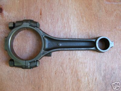 1972 Ford Ranchero - A single connecting rod, likely for a Ford 429 engine, is shown against a wooden background.