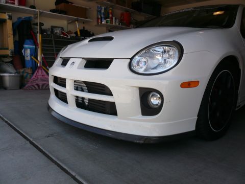 1996 Ford Probe - Front view of a white Dodge SRT-4, showing the distinctive grille and intercooler.