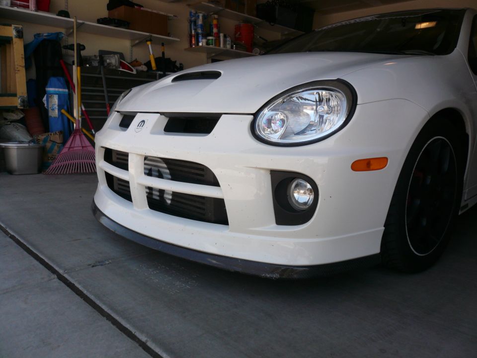 White Dodge SRT-4 front view with intercooler visible behind grille