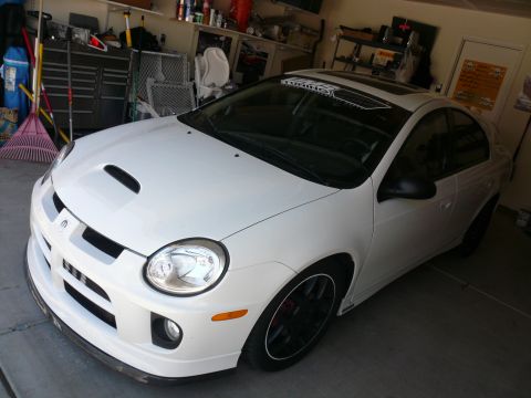 1996 Ford Probe - White Dodge Neon SRT-4 parked in a garage with aftermarket modifications.