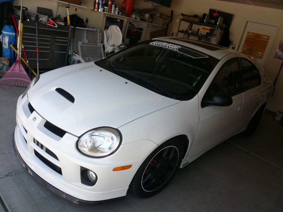 White Dodge Neon SRT-4 with aftermarket hood scoop and black wheels