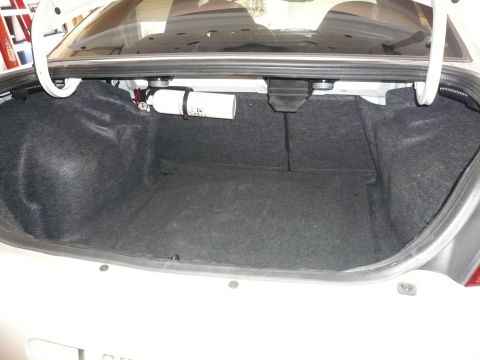 1996 Ford Probe - The trunk of a car is shown, with a nitrous oxide tank visible on the left side.