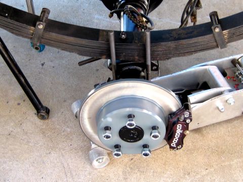 1996 Ford Bronco - Rear suspension assembly showing leaf springs, brake caliper, and rotor.