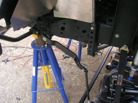 1996 Ford Bronco - Suspension components are visible while the vehicle is supported by jack stands.
