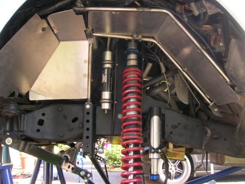1996 Ford Bronco - Close-up view of modified suspension parts, likely for an off-road vehicle.