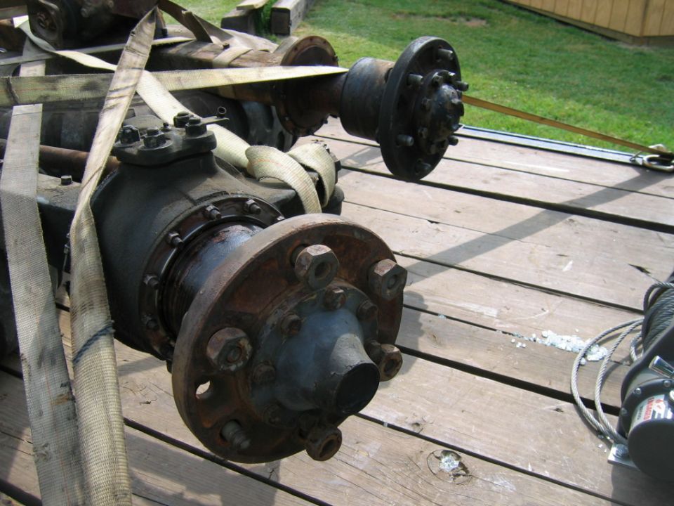 Rear axle assembly on wooden trailer
