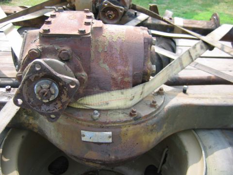 1992 Ford Mustang - This heavily rusted differential assembly is secured with straps, likely for transport.