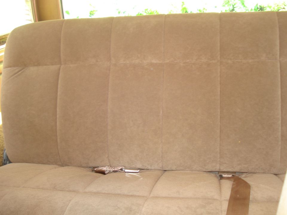 Tan cloth bench seat in a vehicle interior