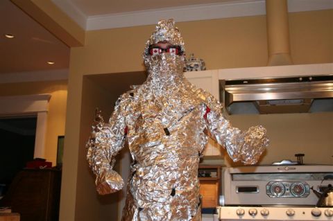1991 Ford Bronco - A person dressed in a full body suit made of aluminum foil stands in a kitchen. The person is wearing glasses with Canadian flags on them.