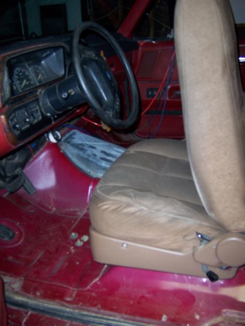 1991 Ford Bronco - Interior view of a 1991 Ford Bronco, showing the dashboard, steering wheel, and passenger seat.
