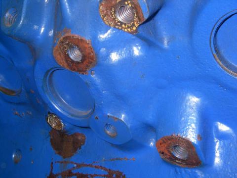 1968 Ford Mustang - Close-up of a blue engine block showing rusted bolt holes and a Supermotors.net watermark.