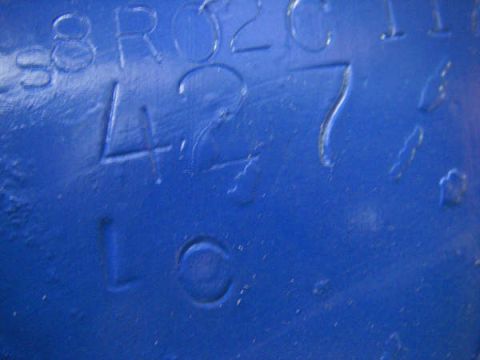 1968 Ford Mustang - Close-up of a blue metal part showing the embossed numbers 427.