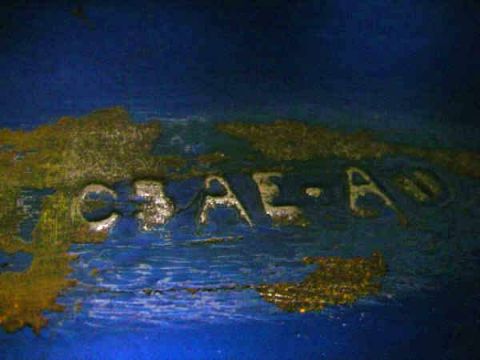 1968 Ford Mustang - A close-up view of a metal part with stamped lettering.