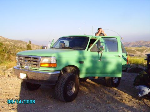 1990 Ford Bronco - This 1990 Ford Bronco is shown in a three-quarter front view with its doors open.