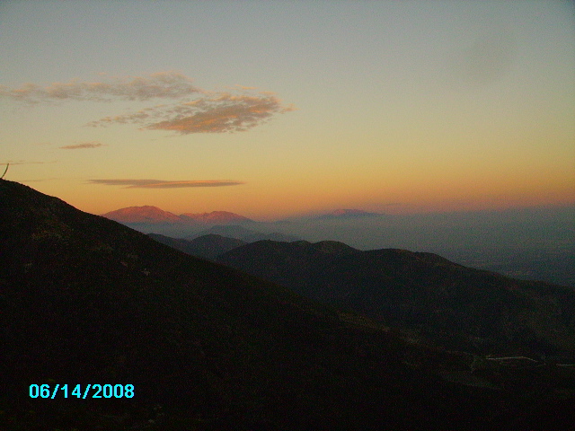 Mountain landscape at sunset with date 06/14/2008 and Supermotors logo
