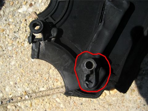 1993 Ford Probe - This damaged plastic component shows a broken mounting bracket, indicating a need for replacement.