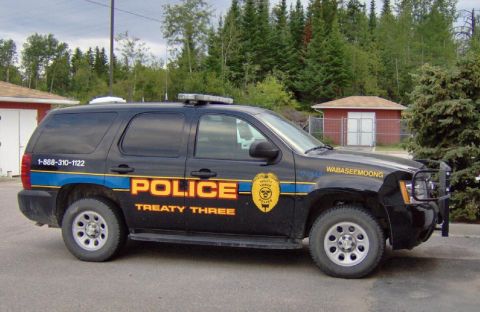 1991 Ford Crown Victoria - Side view of a black police SUV with "POLICE TREATY THREE" markings and "WABASHEEMOONG" on the fender.