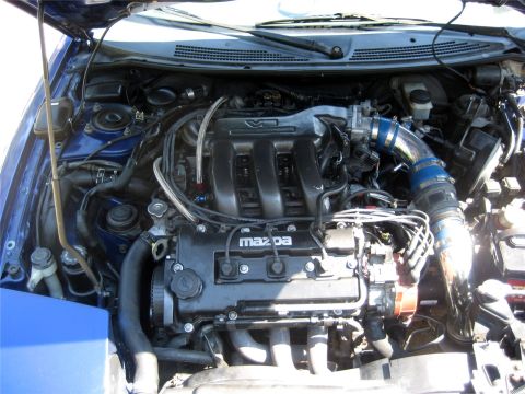1993 Ford Probe - Engine bay view of a Mazda V6, showing intake and valve cover details.