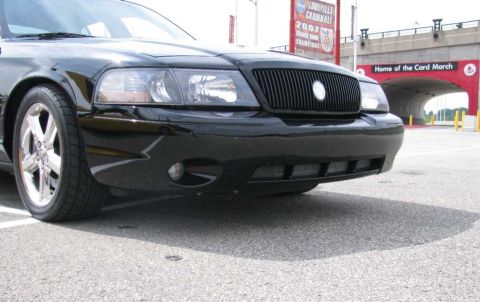 2003 Mercury Marauder - A black 2003 Mercury Marauder is parked in front of a stadium tunnel with 'Home of the Card March' visible.