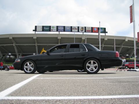 2003 Mercury Marauder - Side view of a black 2003 Mercury Marauder parked near a stadium.