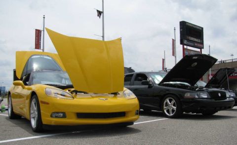 2003 Mercury Marauder - A black 2003 Mercury Marauder is parked with its hood open at an outdoor event.