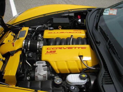 2003 Mercury Marauder - The engine bay of a yellow Corvette shows the LS2 engine with "Corvette" and "LS2 364 ci/400 hp" lettering.