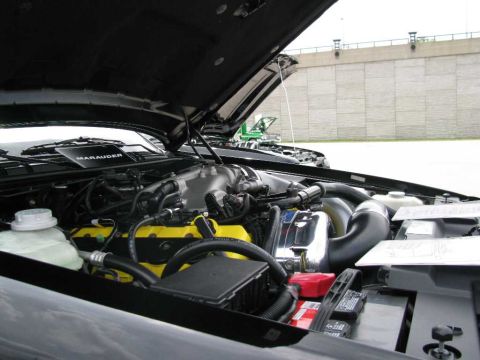 2003 Mercury Marauder - The engine bay of a 2003 Mercury Marauder is shown with the hood open, revealing the engine components.