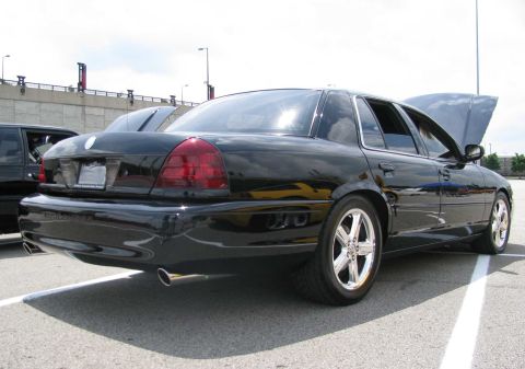 2003 Mercury Marauder - Rear three-quarter view of a black 2003 Mercury Marauder with its hood up.
