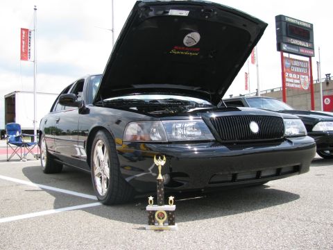 2003 Mercury Marauder - A black 2003 Mercury Marauder is displayed with its hood open, a trophy placed before it.
