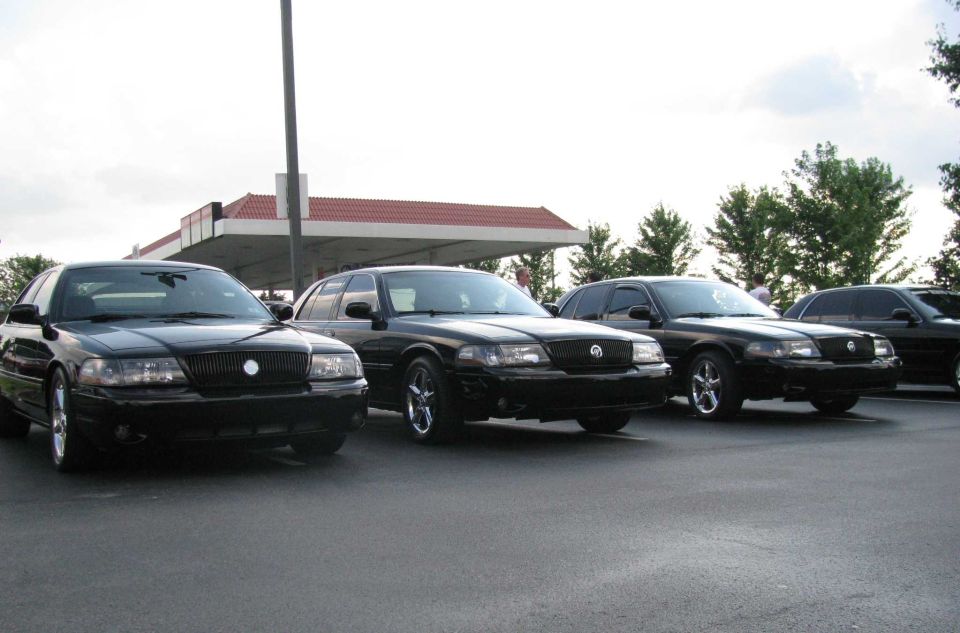 Three black 2003 Mercury Marauders parked in a row