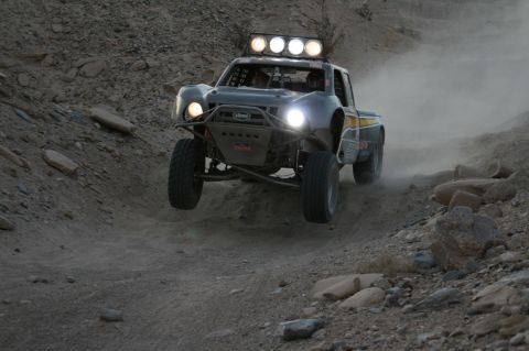 1996 Ford Bronco - This off-road truck is airborne on a dusty desert track.