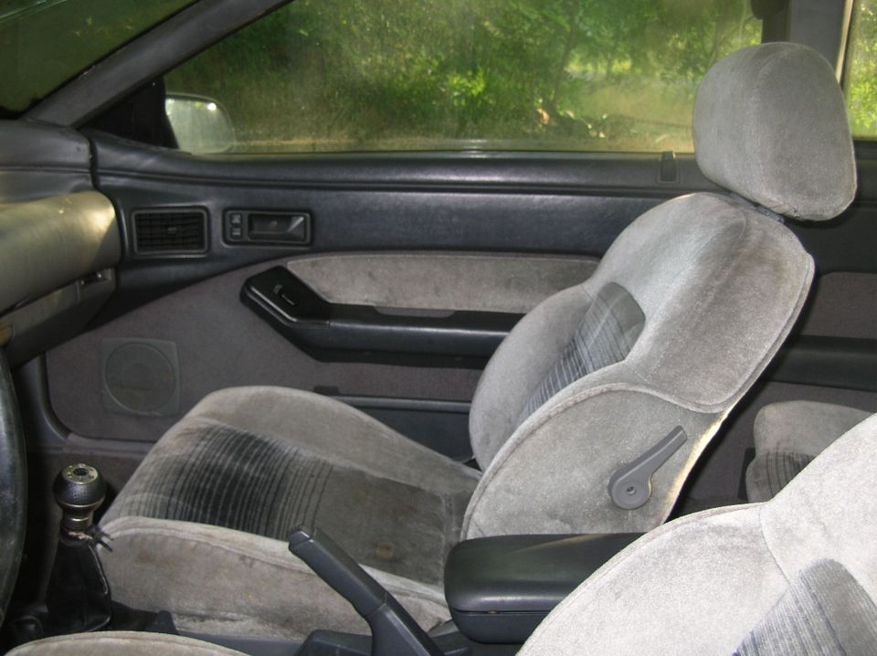 Gray fabric car seats and door panel with a gear shift visible