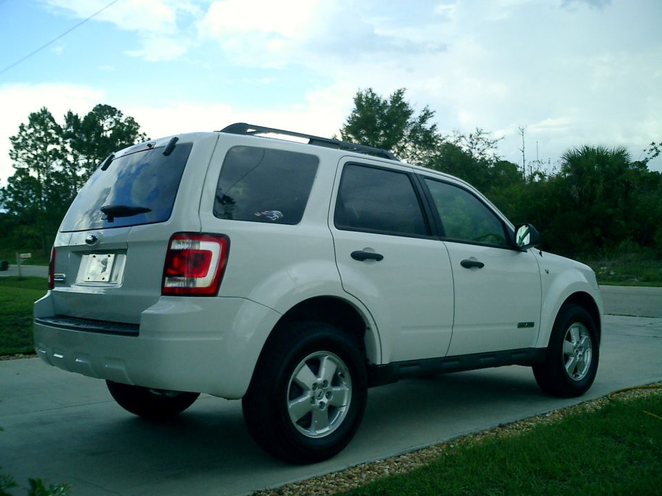 White 2008 Ford Escape parked on a driveway, rear-left view