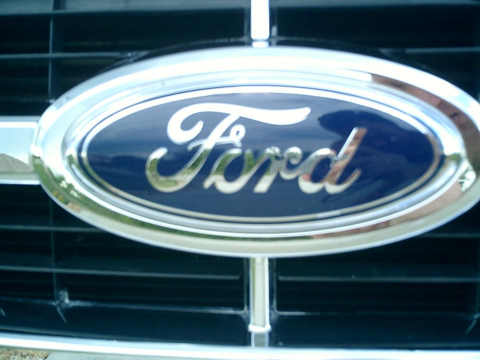 Ford emblem on a dark grille with chrome trim