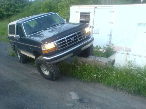 1985 Ford Bronco - This Ford Bronco appears to be from the early to mid-1990s, with its distinctive grille and body style.