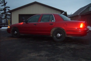 2000 Ford Crown Victoria - Side view of a red 2000 Ford Crown Victoria.