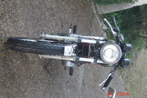 2006 Honda CBR-RR - A motorcycle is shown from the front, a prominent round headlight and chrome detailing on the frame.