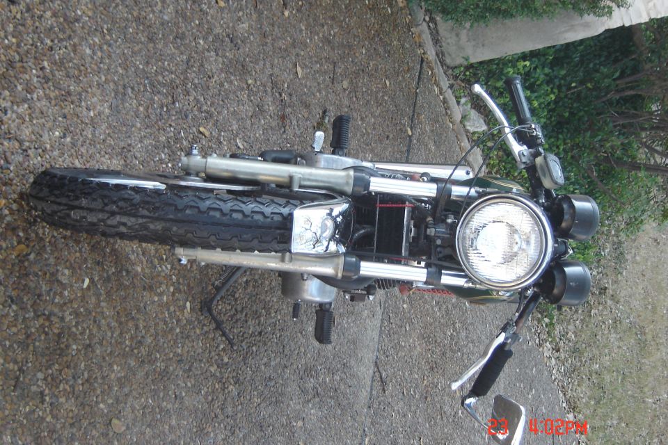 Motorcycle front view with chrome accents and round headlight