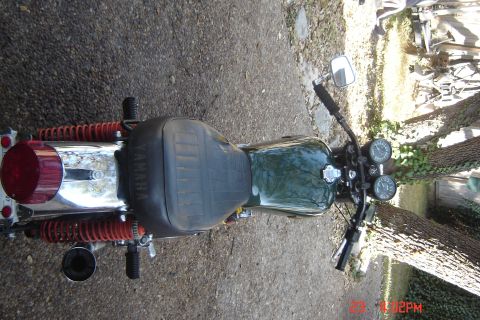 2006 Honda CBR-RR - A vintage Yamaha motorcycle is parked outdoors on a gravel surface.