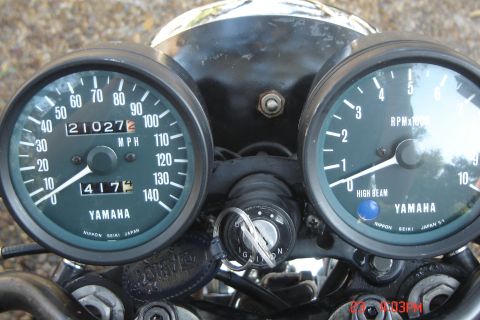 2006 Honda CBR-RR - Close-up of a motorcycle's instrument cluster, dual analog gauges and an ignition switch.