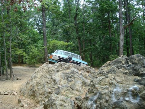 1990 Ford Bronco - This 1990 Ford Bronco tackles a rocky obstacle on an off-road trail.